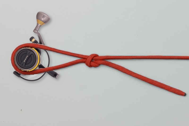 First knot snugged, with the tag still long