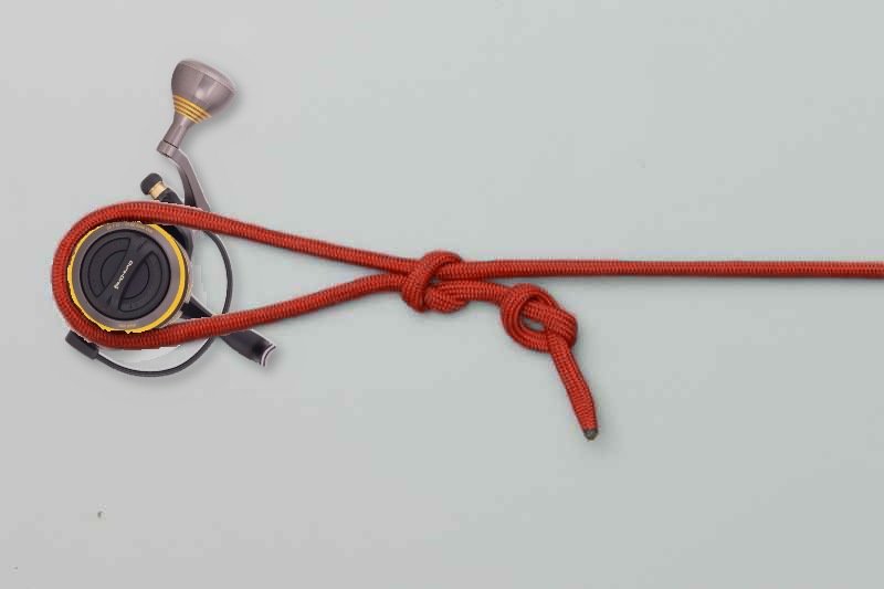 Finished arbor knot, with the loop around the reel and the stopper on the tag