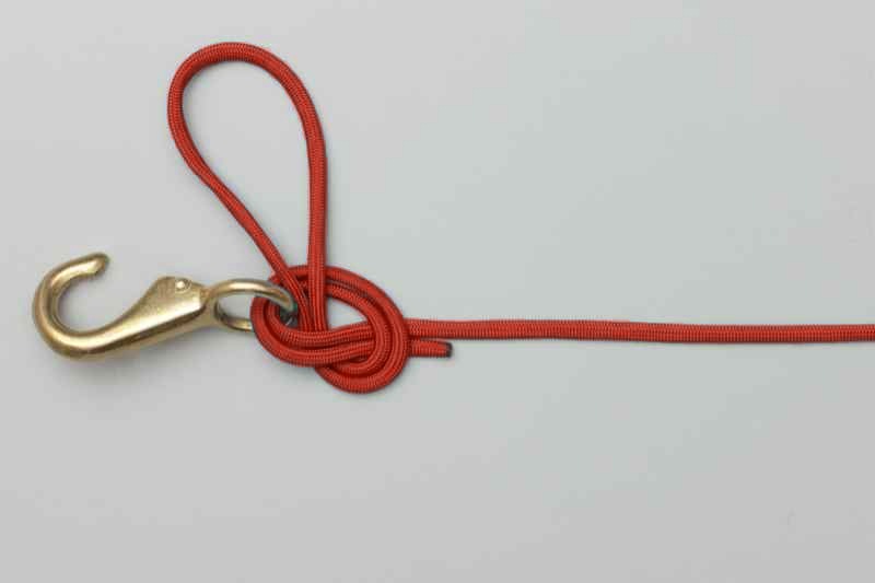 Overhand knot formed, with the loop still open