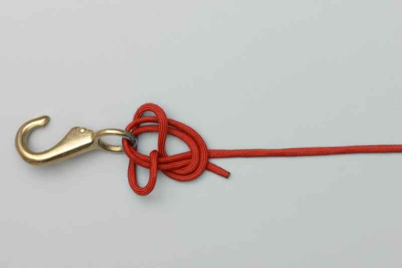 Knot starting to tighten against the hook eye
