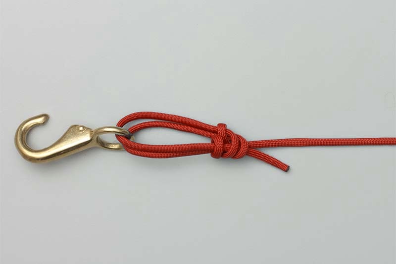 Tag end cinched against the knot