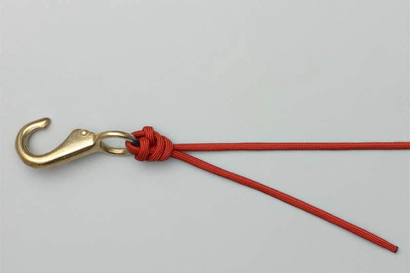 Knot snugged, with the tag still long